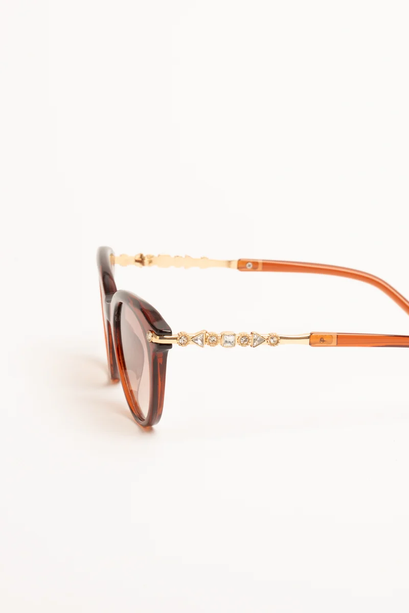 Occhiale da sole rotondi rosso mattone con strass