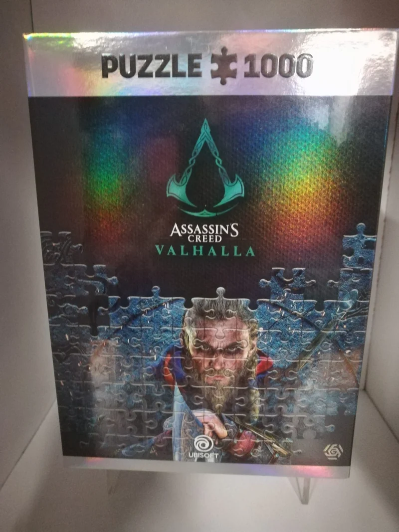 PUZZLE 1000 P.- ASSASSIN'S CREED VALHALLA +POSTER+BEG COTTONE