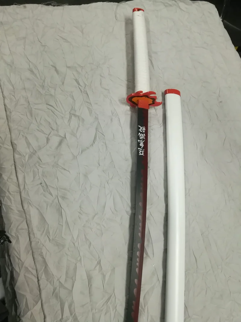 KATANA DEMON SLAYER-KYOJURO RENGOKU- CM 101 IN ACCIAIO SENZA FILO (da 16 anni in su)