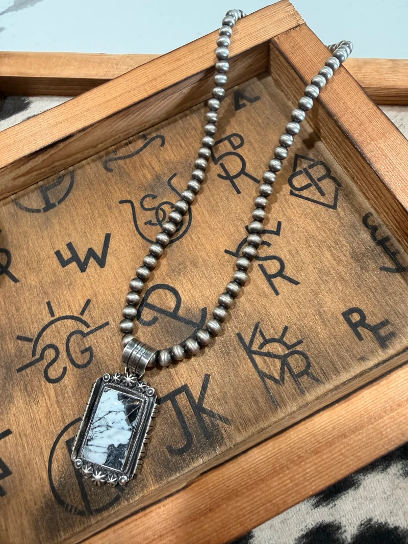White Buffalo Pendant on 5mm Pearls