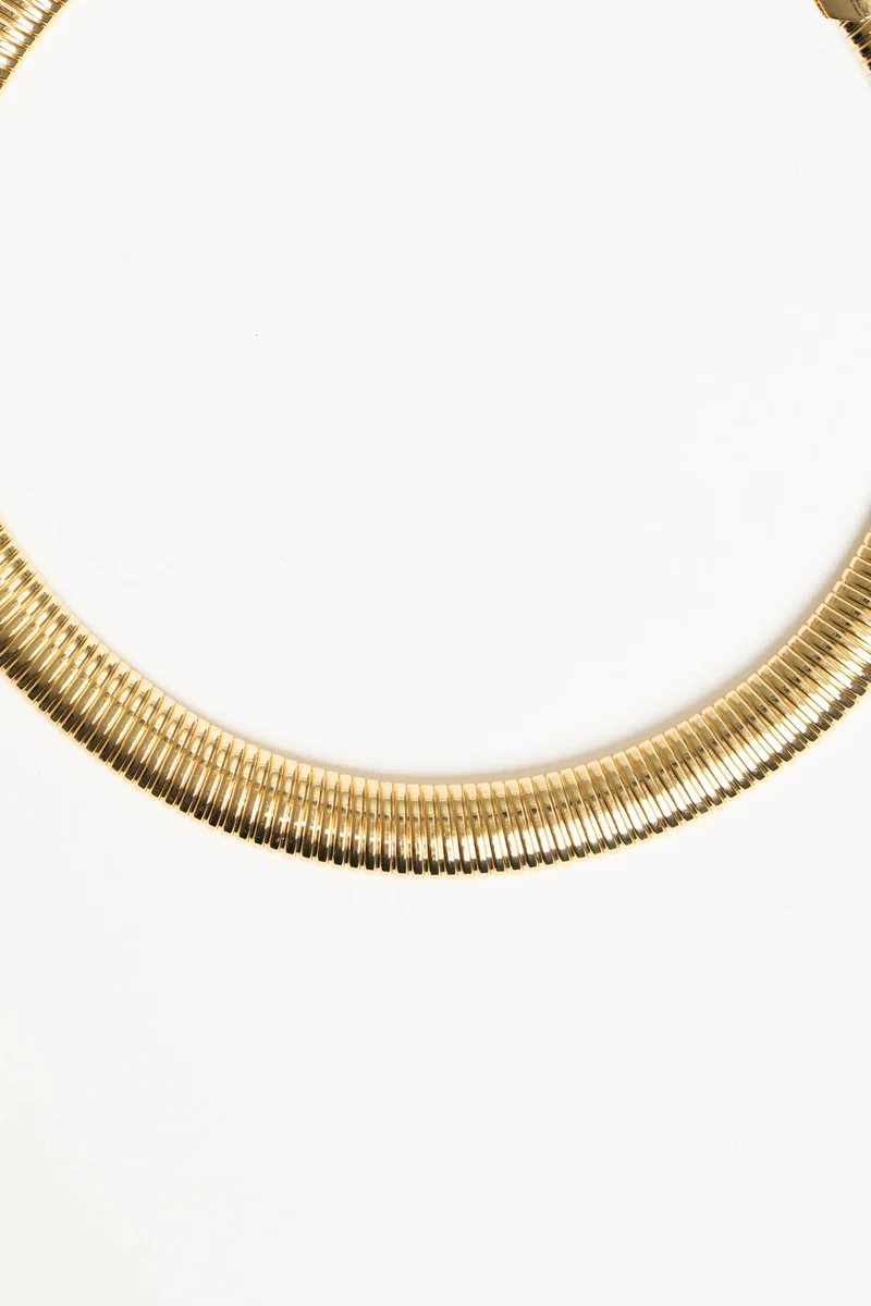 Collana rigida in metallo dorato