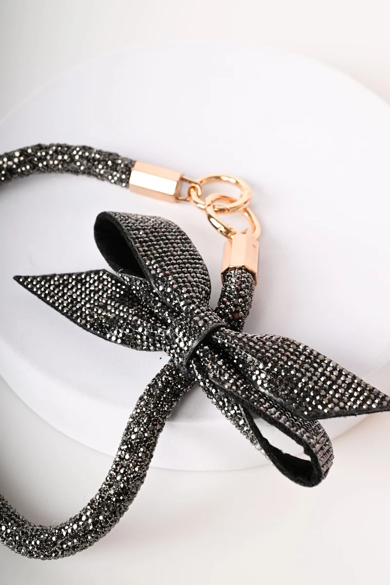 Portachiavi con strass e fiocco